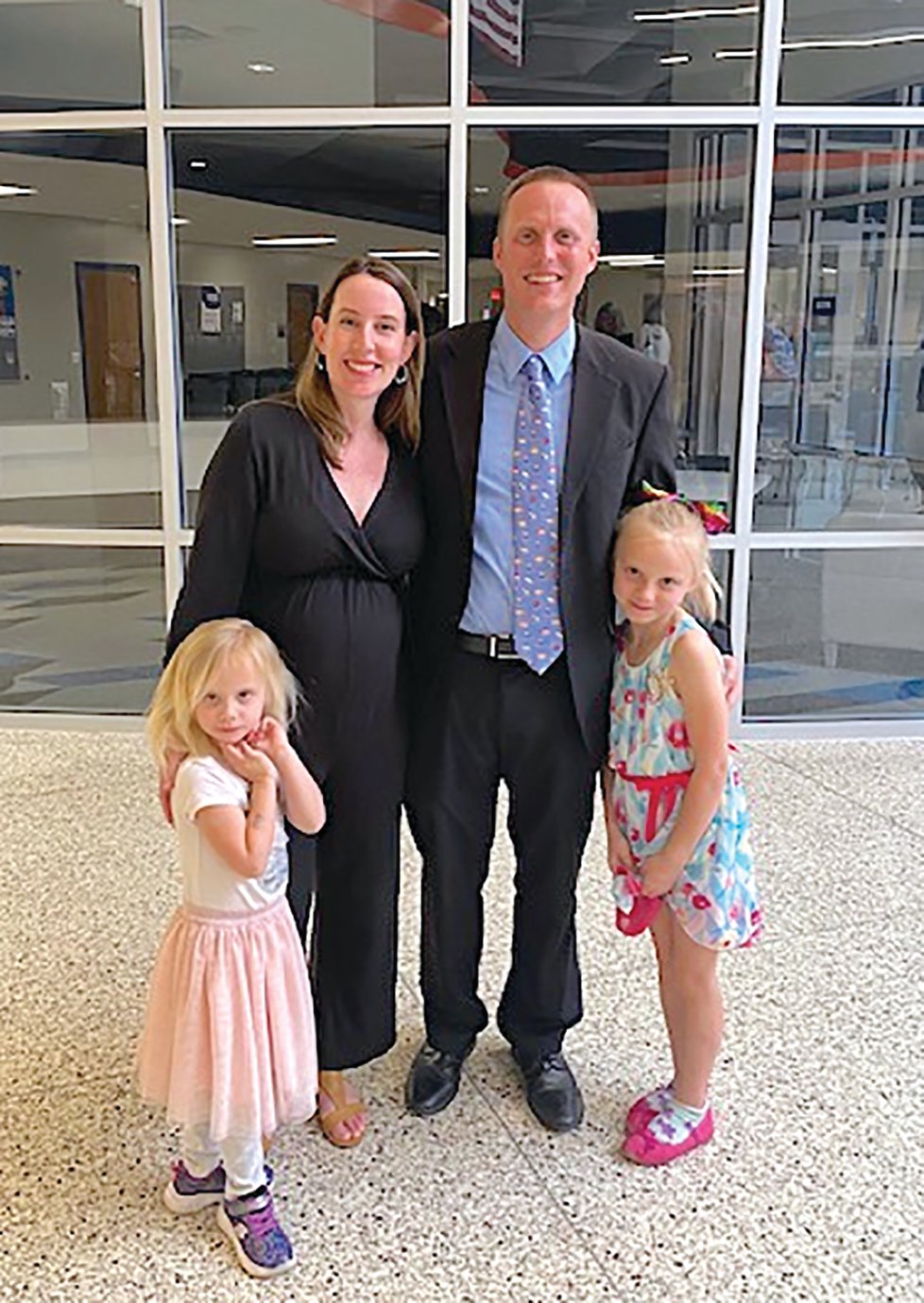 Jonathan Guthrie and his family celebrate approval Monday to become North Montgomery High School’s newest principal following the departure of Michael Cox. Guthrie, along with wife Becky and his two children, are set to welcome a third later this year.